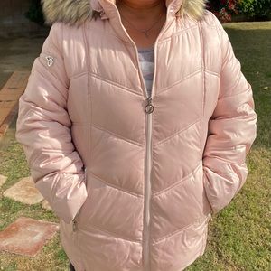 Light pink jacket. It’s water resistant and has a hoodie.